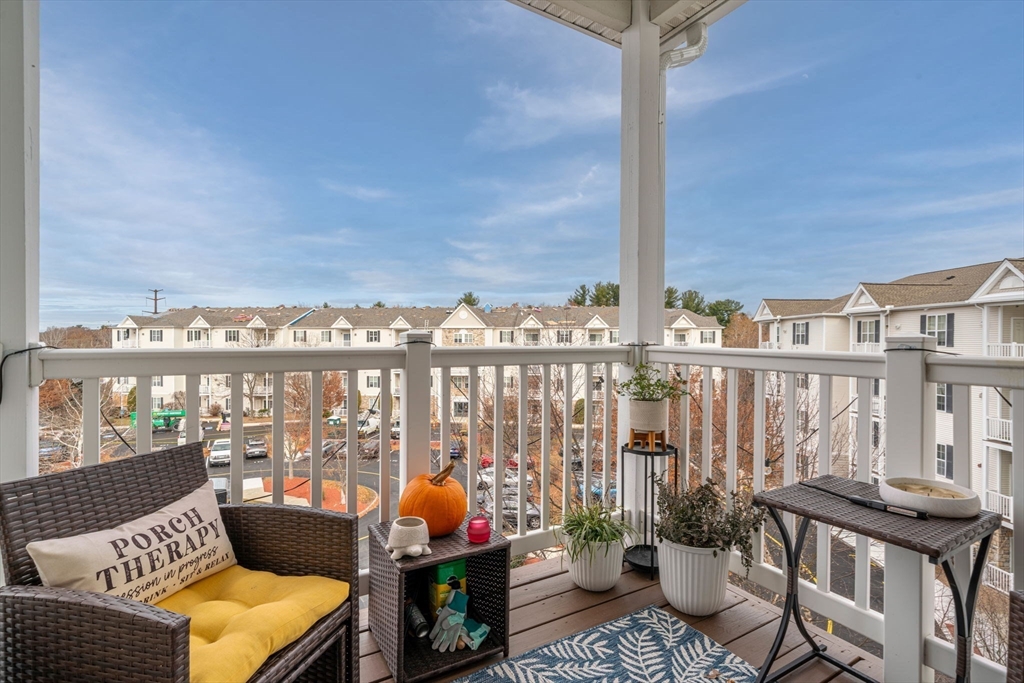 21 Hampshire Road, Unit 412 Methuen, MA 01844 - Photo 27 of 37 a balcony with furniture and water view