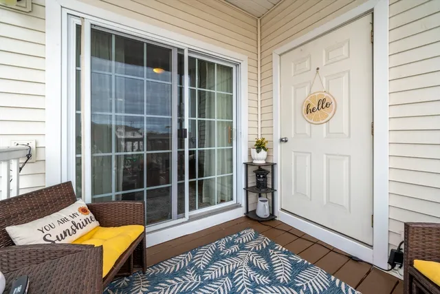 a view of a balcony with an outdoor seating