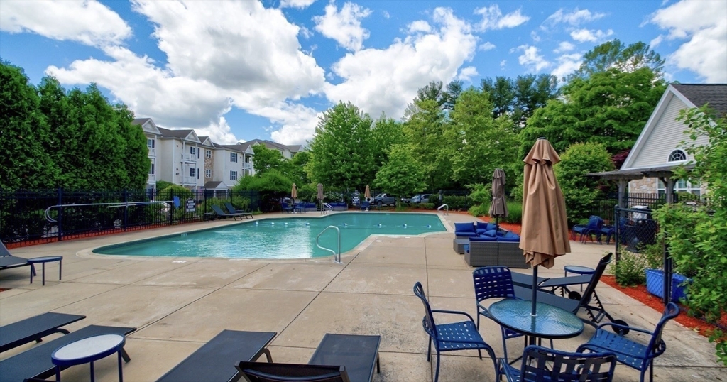 21 Hampshire Road, Unit 412 Methuen, MA 01844 - Photo 31 of 37 a view of a backyard with sitting area
