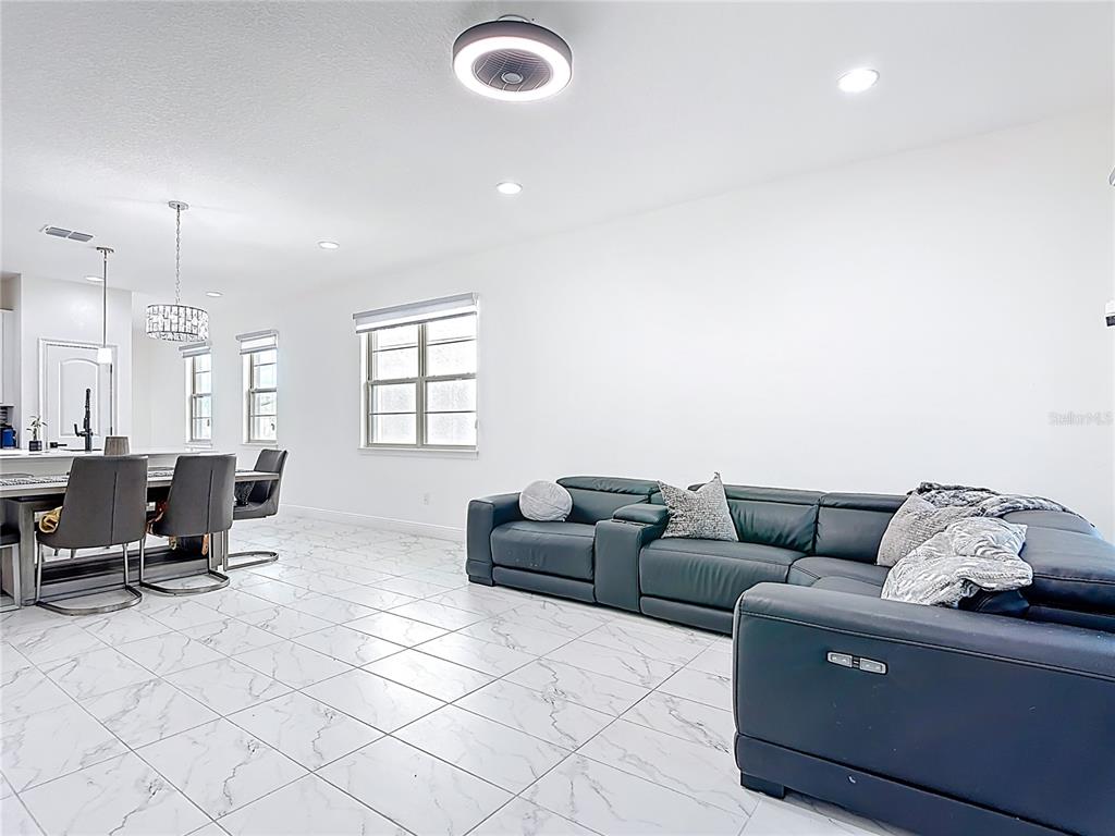 7541 Wing Span Way Harmony, FL 34773 - Photo 16 of 49 a living room with furniture and a window