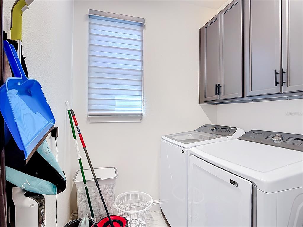 7541 Wing Span Way Harmony, FL 34773 - Photo 27 of 49 a utility room with dryer and washer