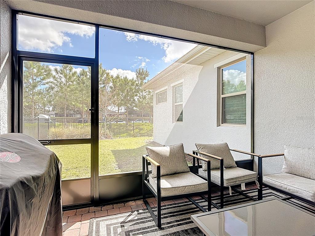 7541 Wing Span Way Harmony, FL 34773 - Photo 29 of 49 a living room with furniture and a window