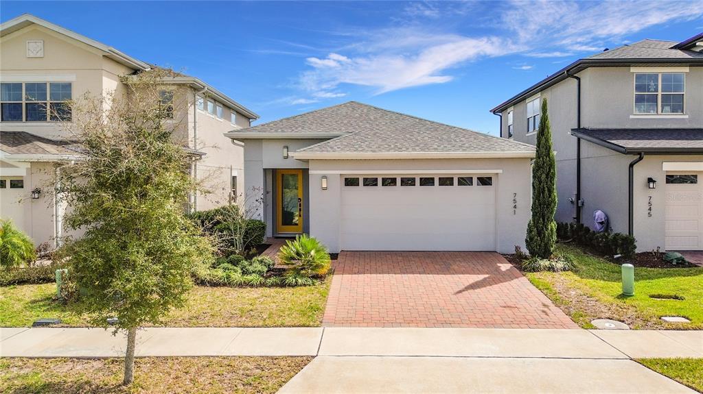 7541 Wing Span Way Harmony, FL 34773 - Photo 49 of 49 a front view of a house with garden