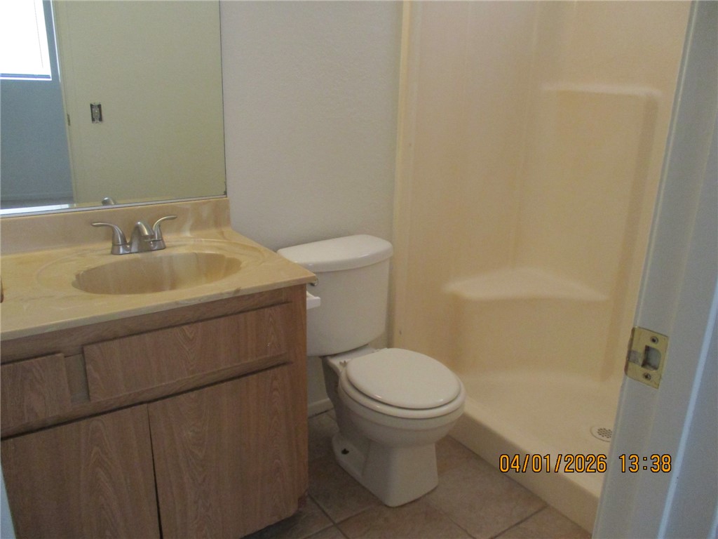 363 Rio Grande Court, Unit B Bullhead City, AZ 86442 - Photo 11 of 16 a bathroom with a sink toilet and a mirror