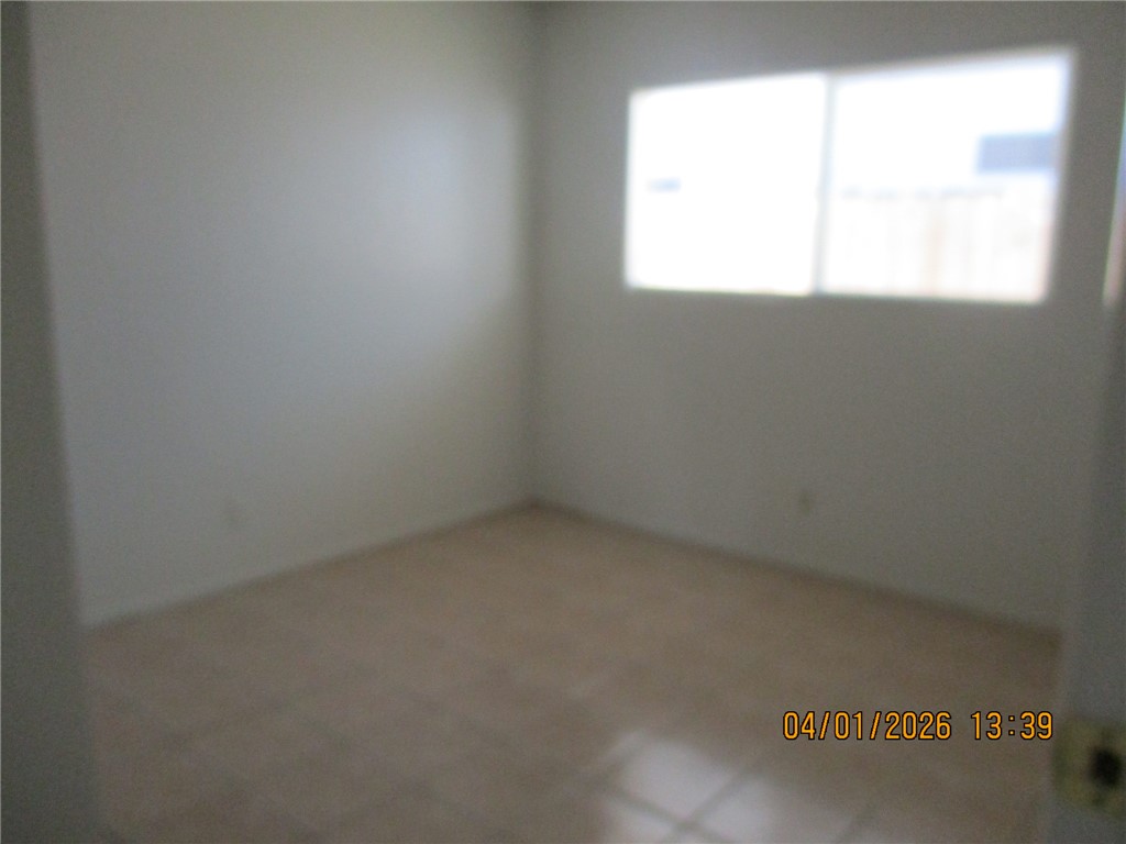 363 Rio Grande Court, Unit B Bullhead City, AZ 86442 - Photo 12 of 16 an empty room with a window