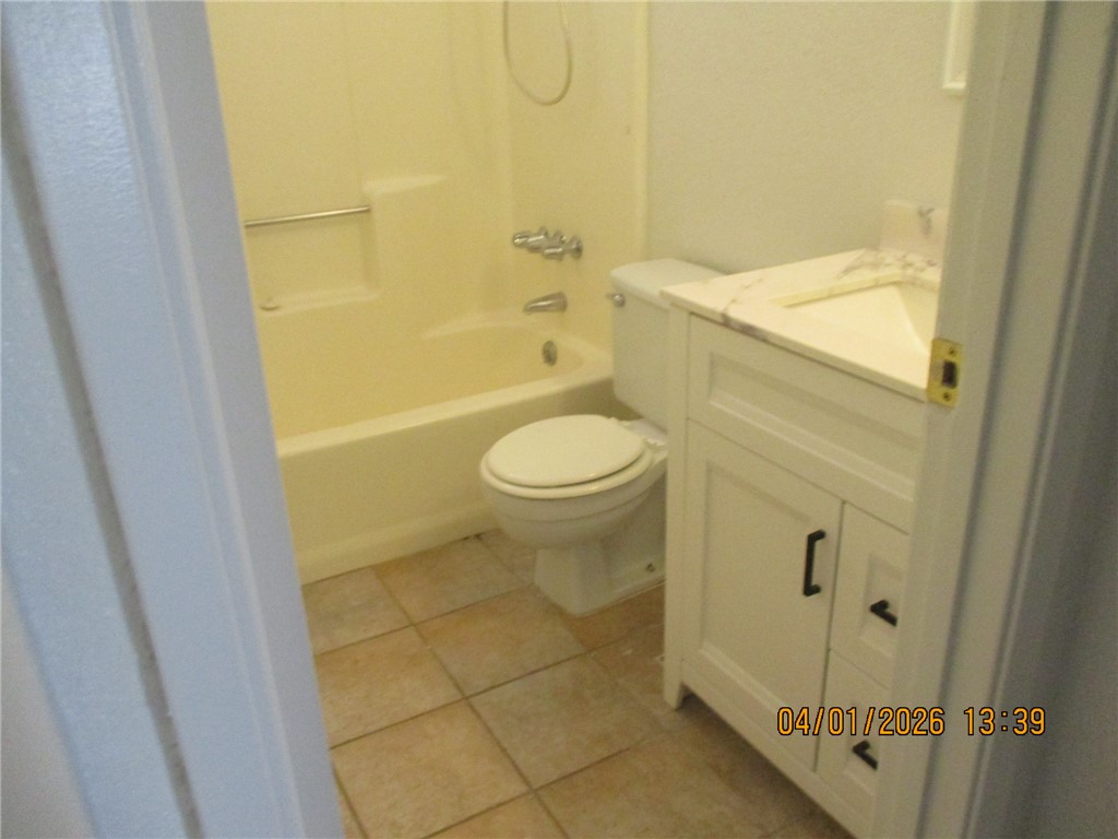 363 Rio Grande Court, Unit B Bullhead City, AZ 86442 - Photo 13 of 16 a bathroom with a granite countertop sink toilet and shower