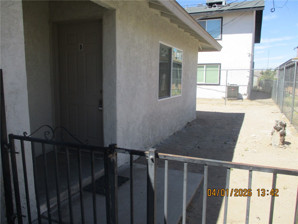363 Rio Grande Court, Unit B Bullhead City, AZ 86442 - Photo 16 of 16 a view of balcony with wooden floor and fence
