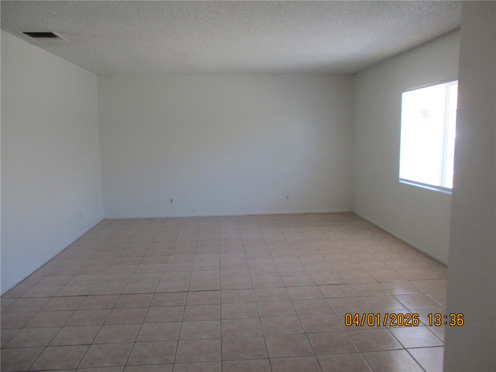 363 Rio Grande Court, Unit B Bullhead City, AZ 86442 - Photo 2 of 16 an empty room with a window