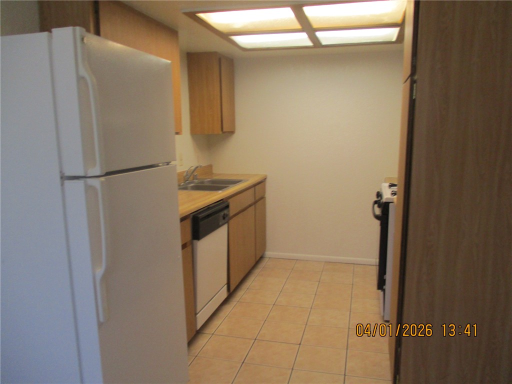 363 Rio Grande Court, Unit B Bullhead City, AZ 86442 - Photo 7 of 16 a utility room with washer and dryer