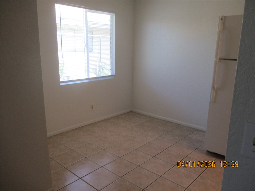 363 Rio Grande Court, Unit B Bullhead City, AZ 86442 - Photo 8 of 16 an empty room with windows