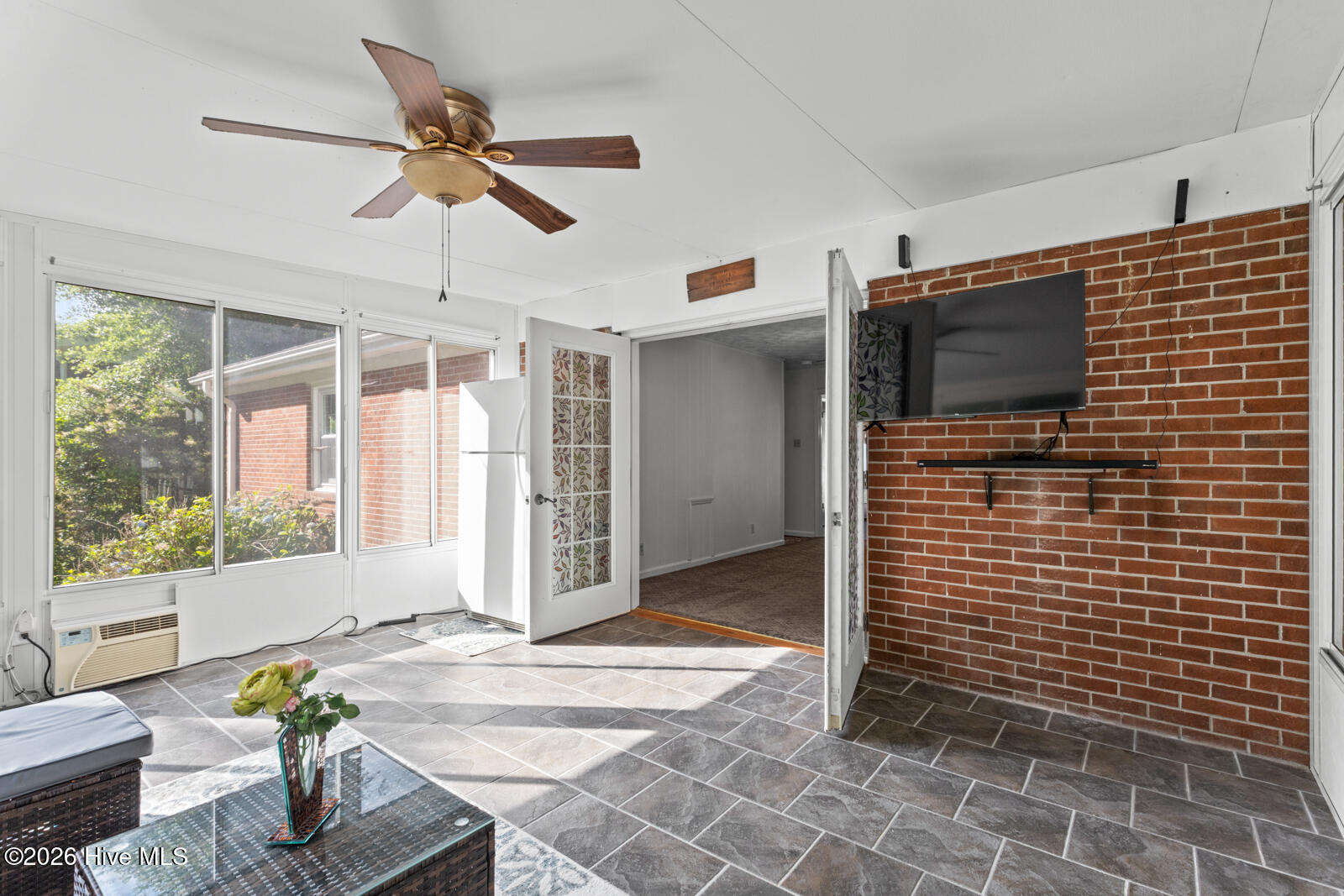 6 Laran Road Jacksonville, NC 28540 - Photo 26 of 41 The Sunroom With Additional Refrigerator And TV With Soundbar Which Will Convey