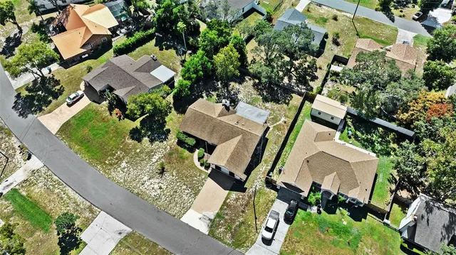 an aerial view of a house with outdoor space