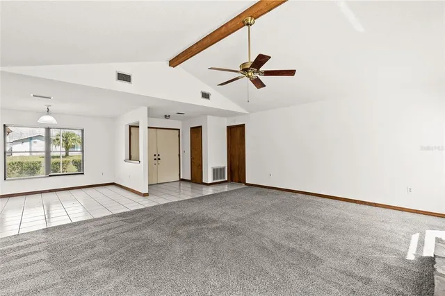 a view of empty room with windows