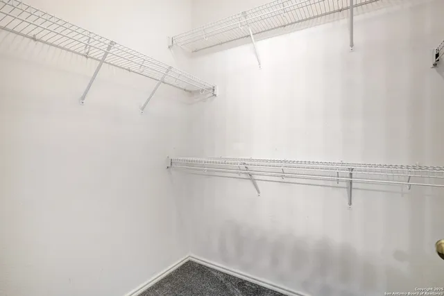 a view of a room with racks on the wall