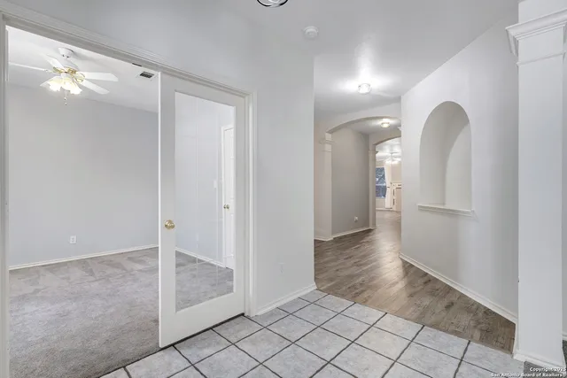 a view of a room with wooden floor