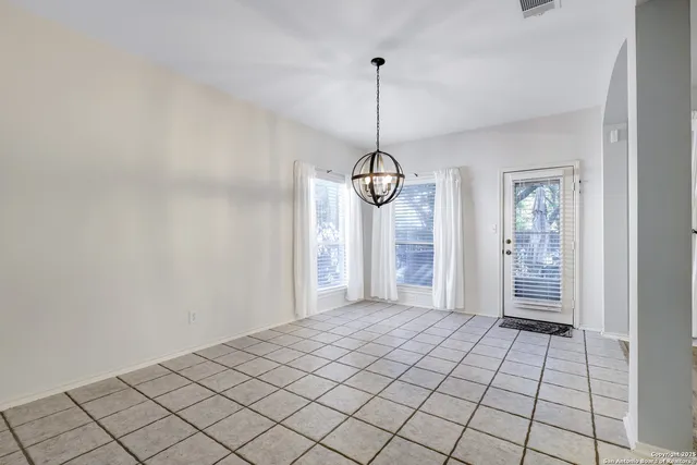 a view of an empty room and window