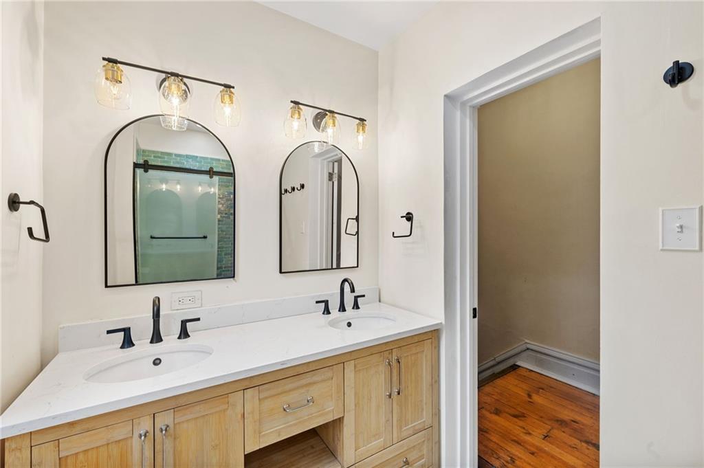 295 Fisk Street Pittsburgh, PA 15201 - Photo 11 of 29 a bathroom with 2 sink and a mirror