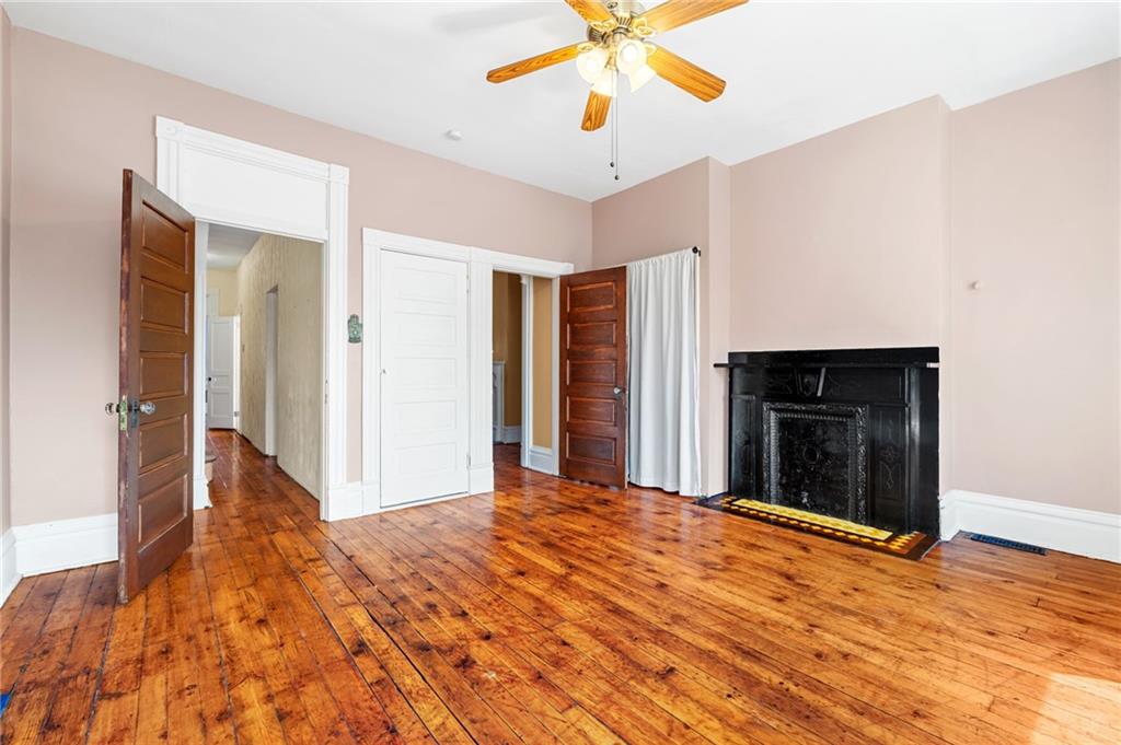 295 Fisk Street Pittsburgh, PA 15201 - Photo 16 of 29 a view of a livingroom with a chandelier fan and a kitchen