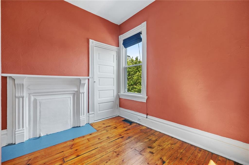 295 Fisk Street Pittsburgh, PA 15201 - Photo 19 of 29 a view of empty room with wooden floor and fan