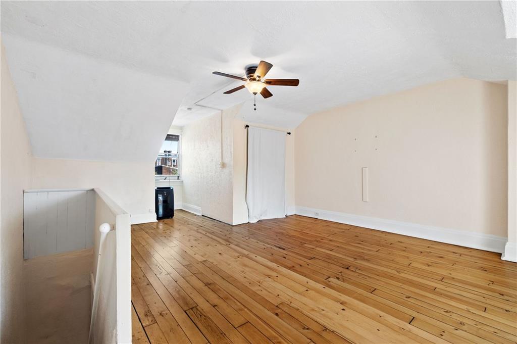 295 Fisk Street Pittsburgh, PA 15201 - Photo 20 of 29 a view of a bedroom a ceiling fan and wooden floor