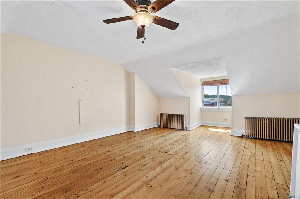 295 Fisk Street Pittsburgh, PA 15201 - Photo 21 of 29 wooden floor in an empty room with a window