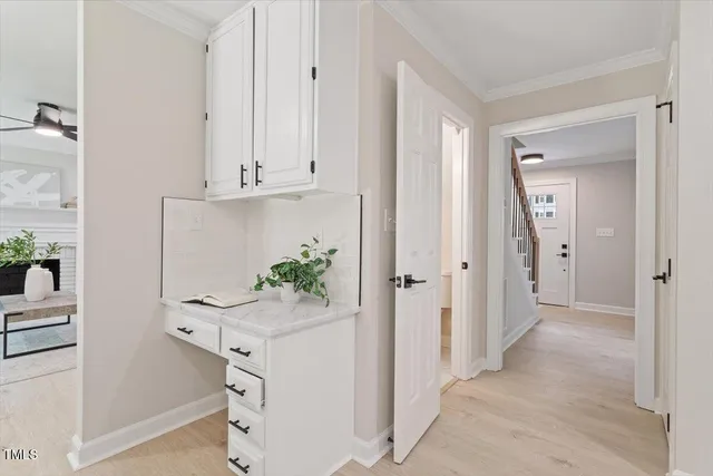 a view of an entryway with wooden floor