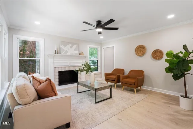 a living room with furniture and a fireplace
