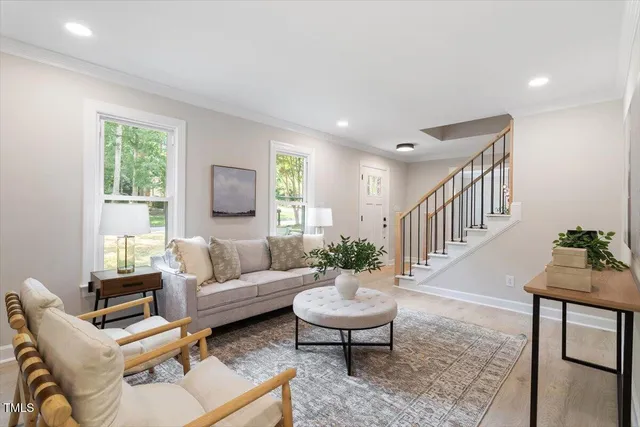 a living room with furniture and a table