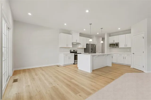 a view of kitchen with wooden floor