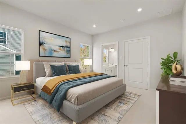 a spacious bedroom with a bed and a potted plant