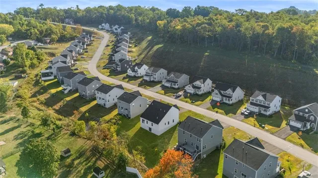 an aerial view of a house with a lake view