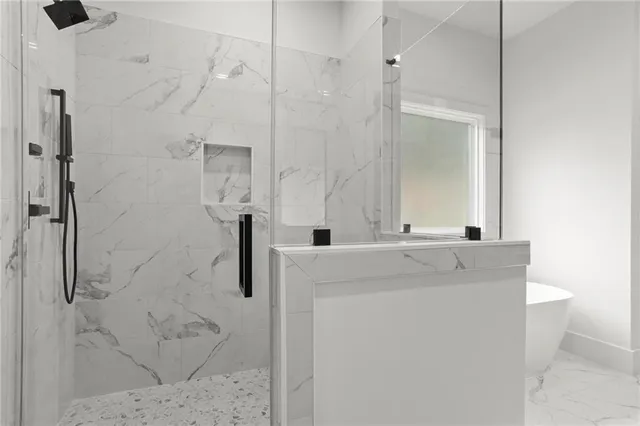 a bathroom with a shower and a sink