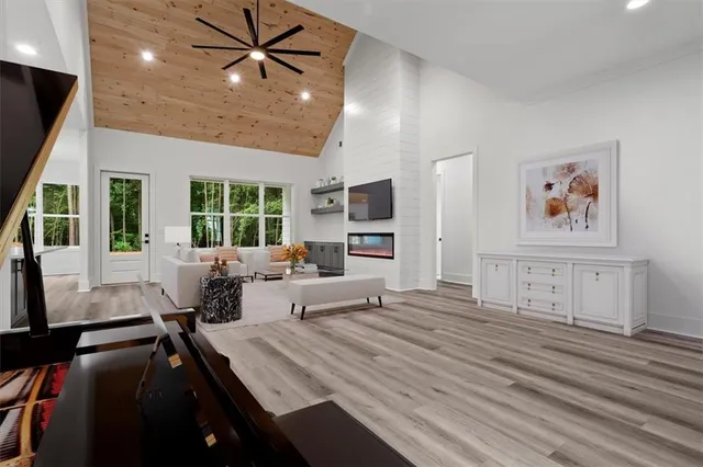 a living room with furniture a large window with wooden floor