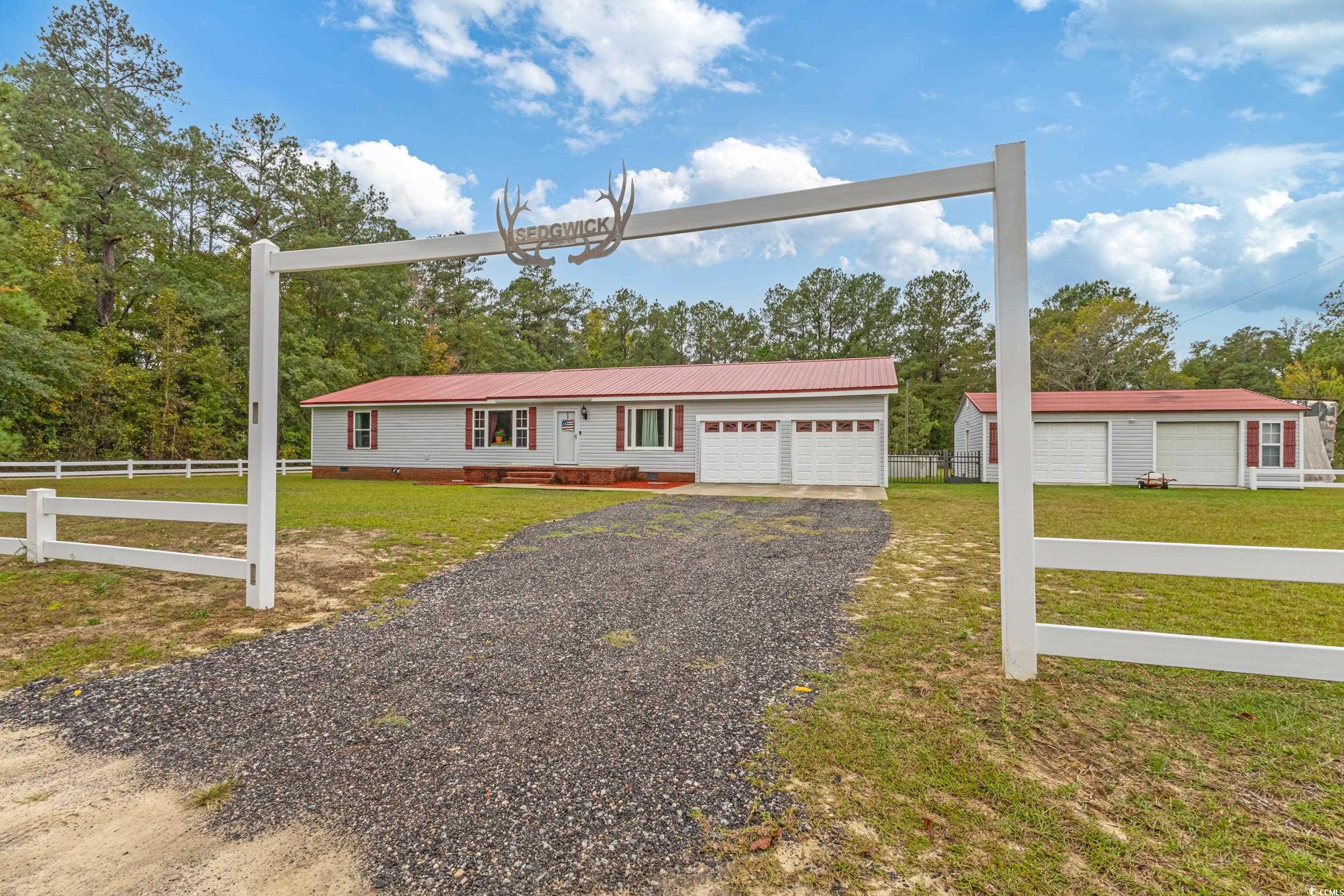 Ranch-style home with a metal roof and crawl space