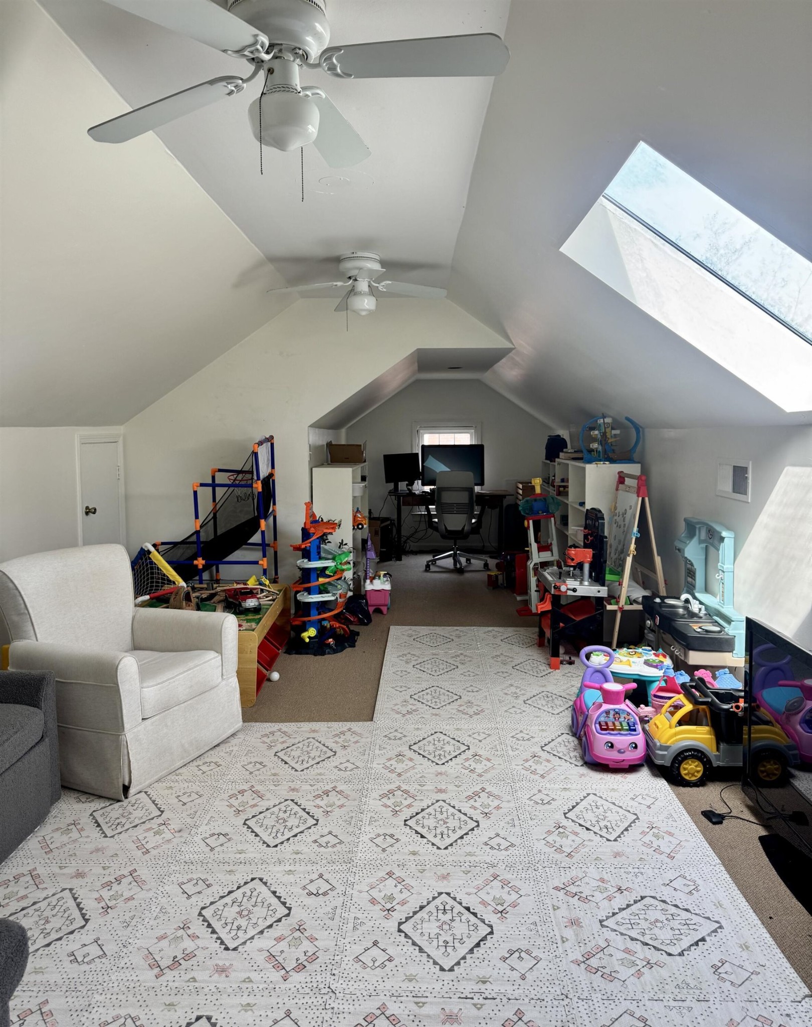 240 Avon Road Memphis, TN 38117 - Photo 19 of 27 a view of a garage with a couch and a chandelier