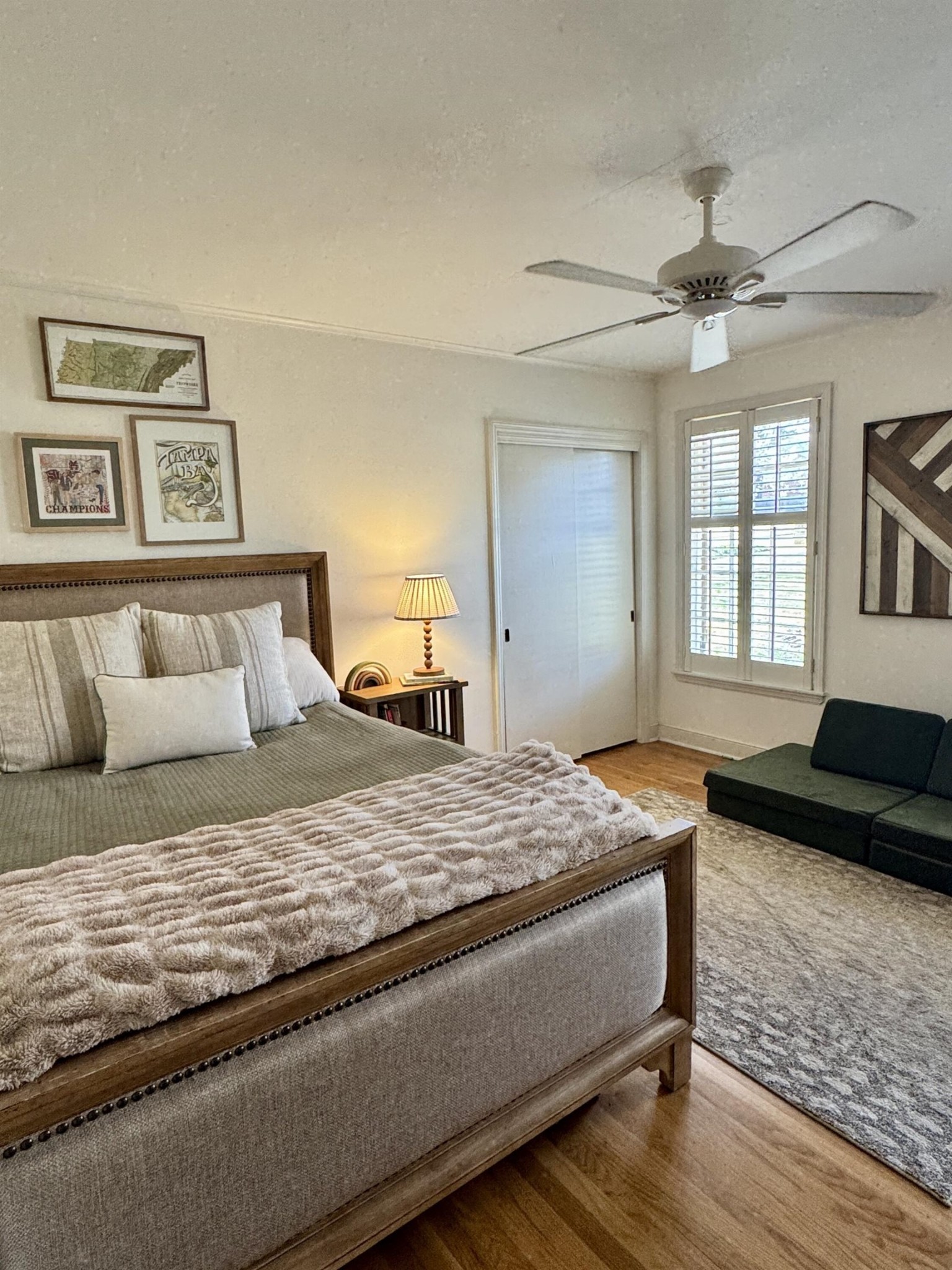 240 Avon Road Memphis, TN 38117 - Photo 7 of 27 a bedroom with a bed and wooden floor