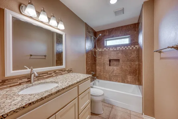 a view of a backyard with a patio