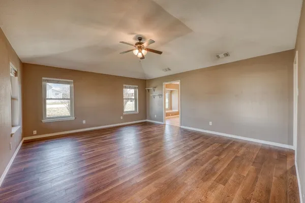a view of an empty room with a window