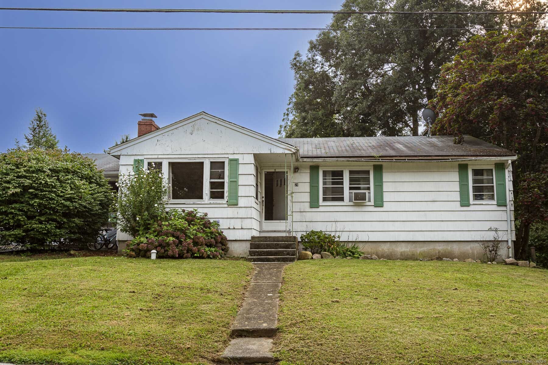 a front view of a house with swimming pool