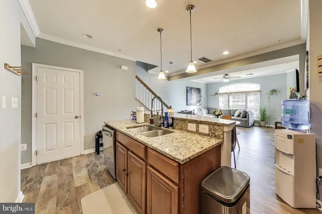 a view of a kitchen center island and living room
