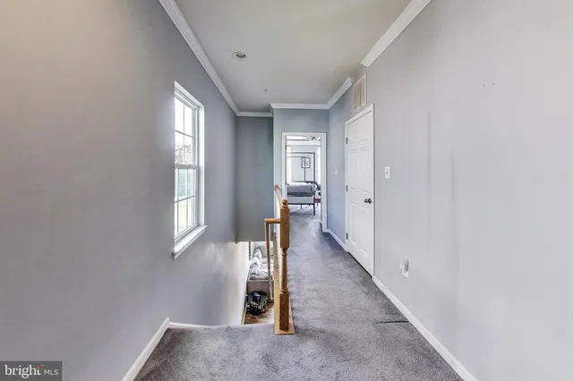 a view of a hallway with windows