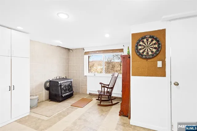 a view of a livingroom with workspace and a couch