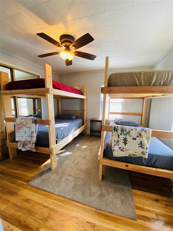 806 North 10th Street Haskell, TX 79521 - Photo 13 of 16 a bed room with a bed and a couch