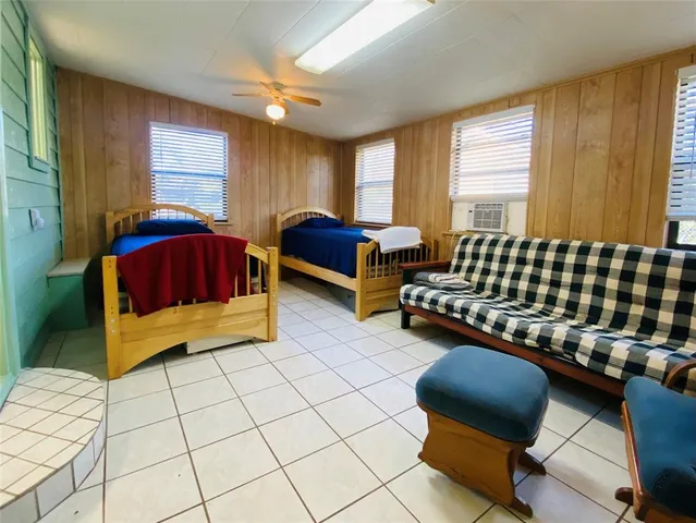 a bedroom with furniture and a window