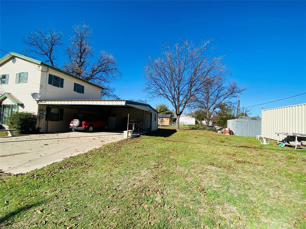 806 North 10th Street Haskell, TX 79521 - Photo 16 of 16 a front view of a house with a yard