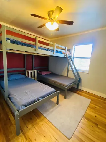 a bed room with a bed and a chandelier