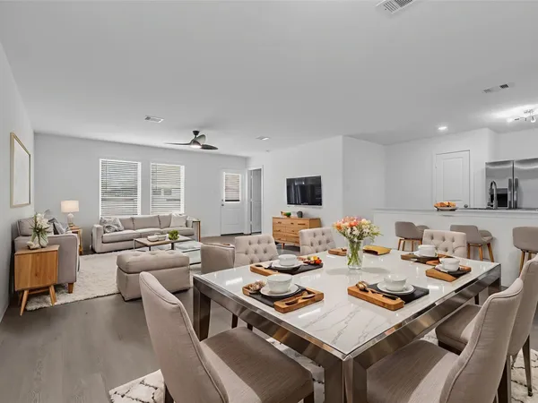 a living room with furniture and a table