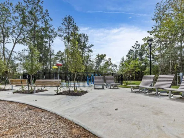 a view of a park with swings and slides