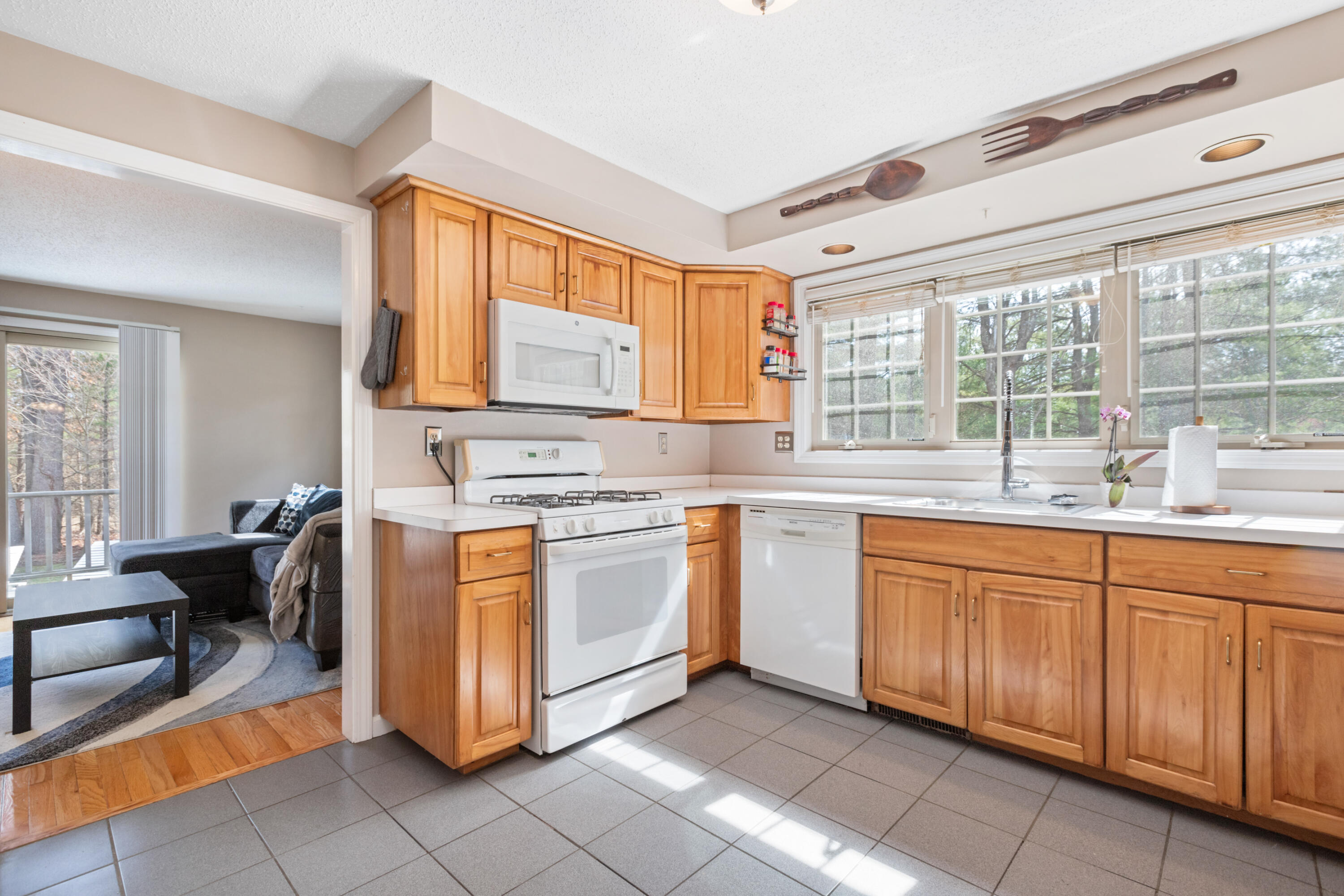 2806 Maple Brook Road Bellingham, MA 02019 - Photo 11 of 38 a kitchen with stainless steel appliances granite countertop a stove a sink and a microwave