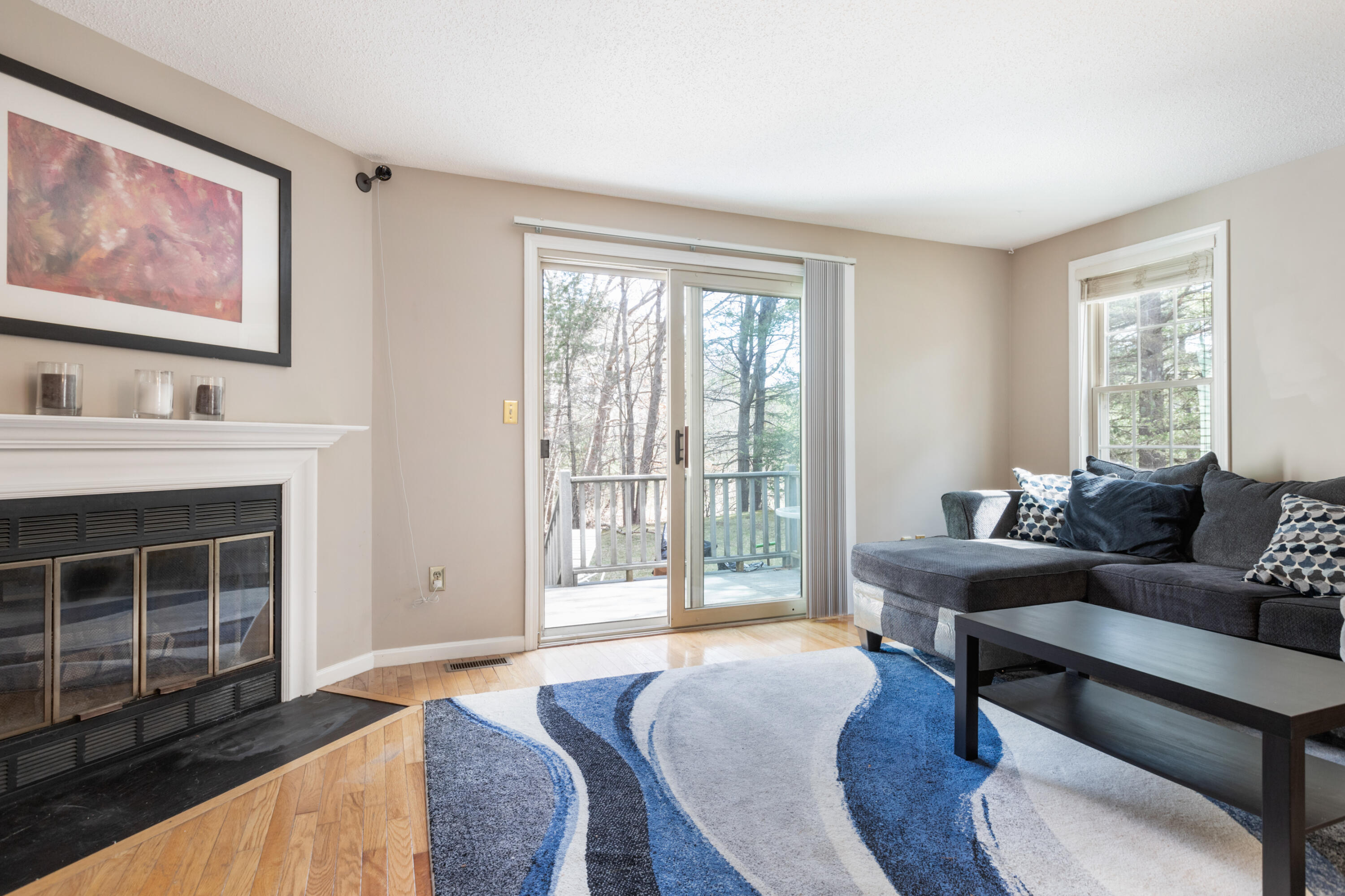 2806 Maple Brook Road Bellingham, MA 02019 - Photo 13 of 38 a living room with furniture and a fireplace